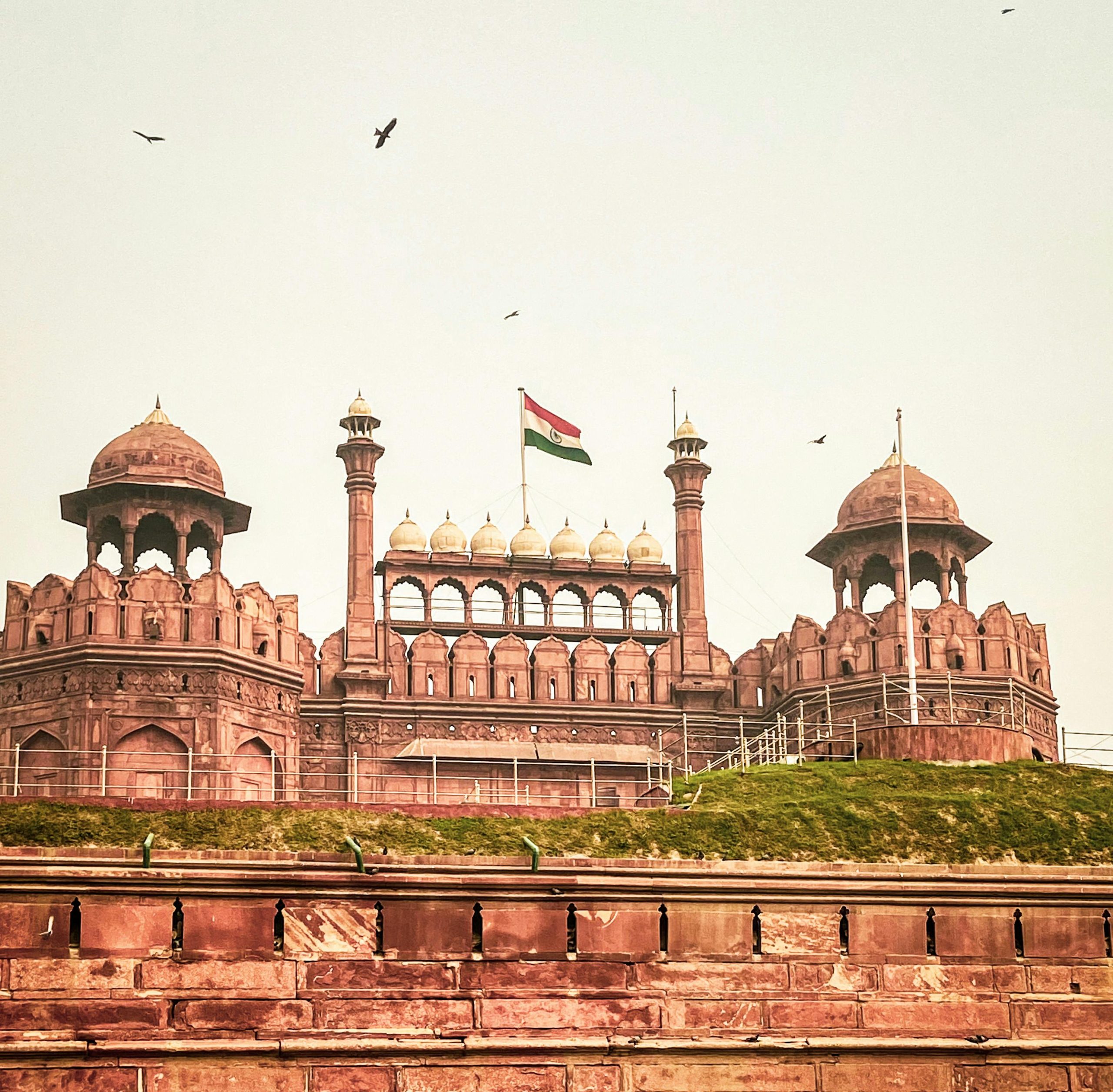 Historic Red Fort in New Delhi showcasing stunning Mughal architecture and the Indian flag.