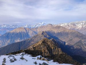 Stunning panoramic view of snow-capped Himalayan peaks at Tungnath, India.